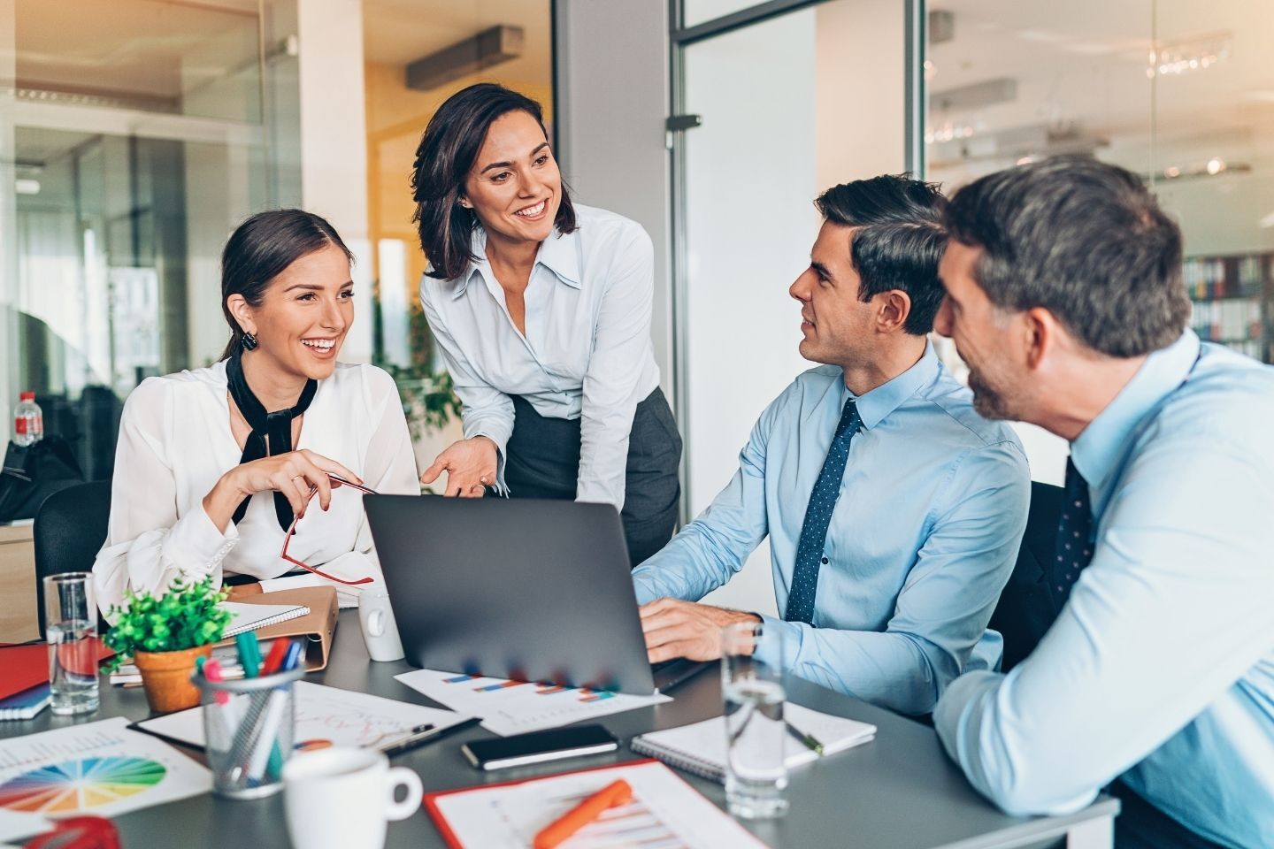 Professional leading a team utilising skills from the AI Leader apprenticeship.